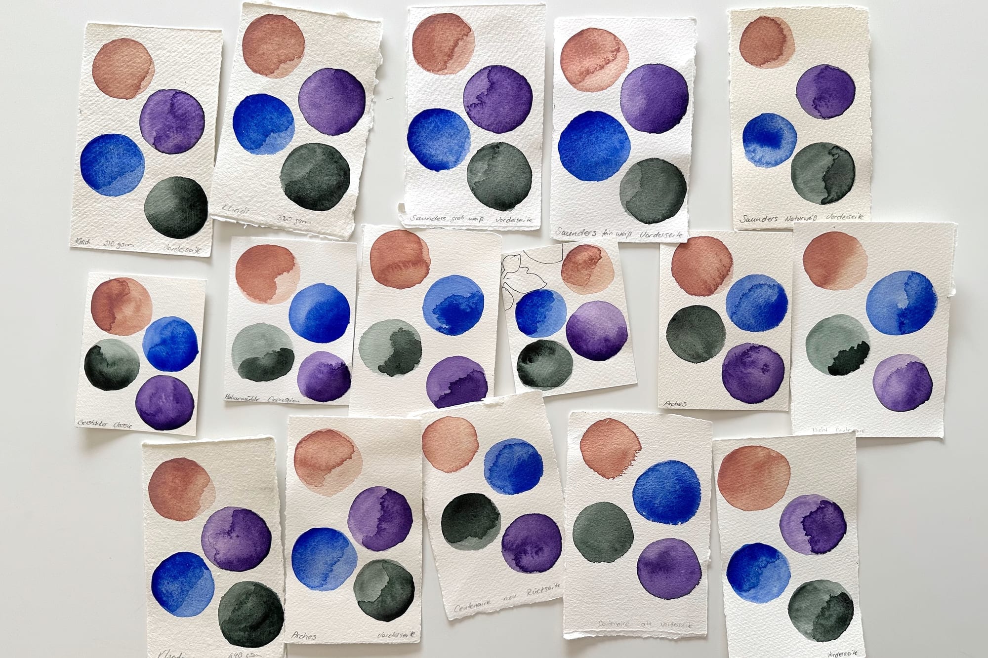 An overview of numerous labeled watercolor paper test swatches