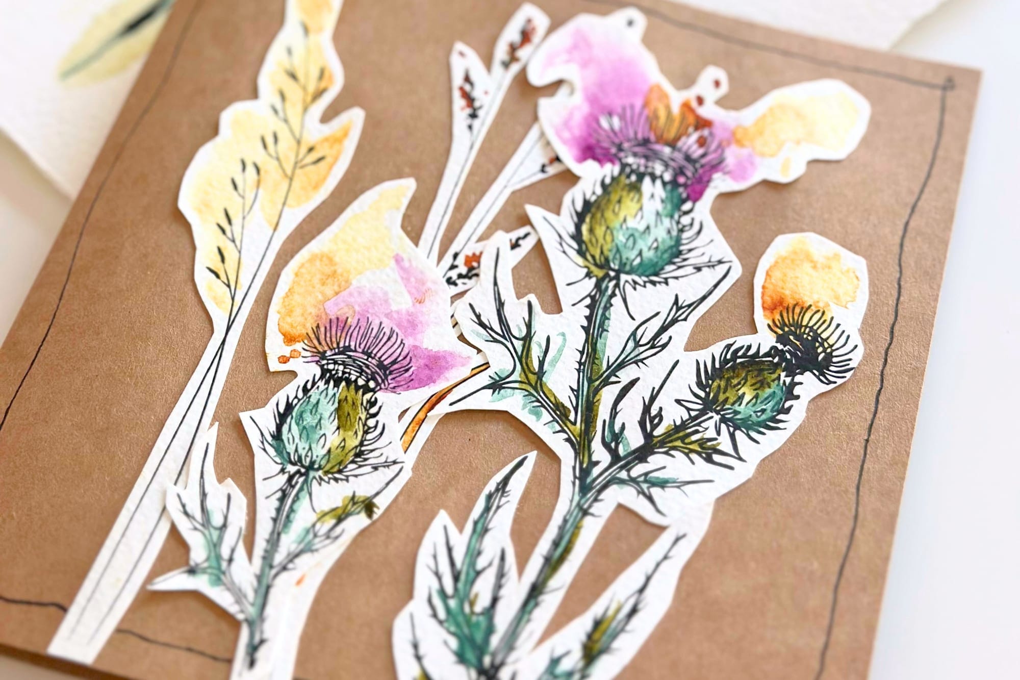 Close-up of the layered thistles glued onto the folding card