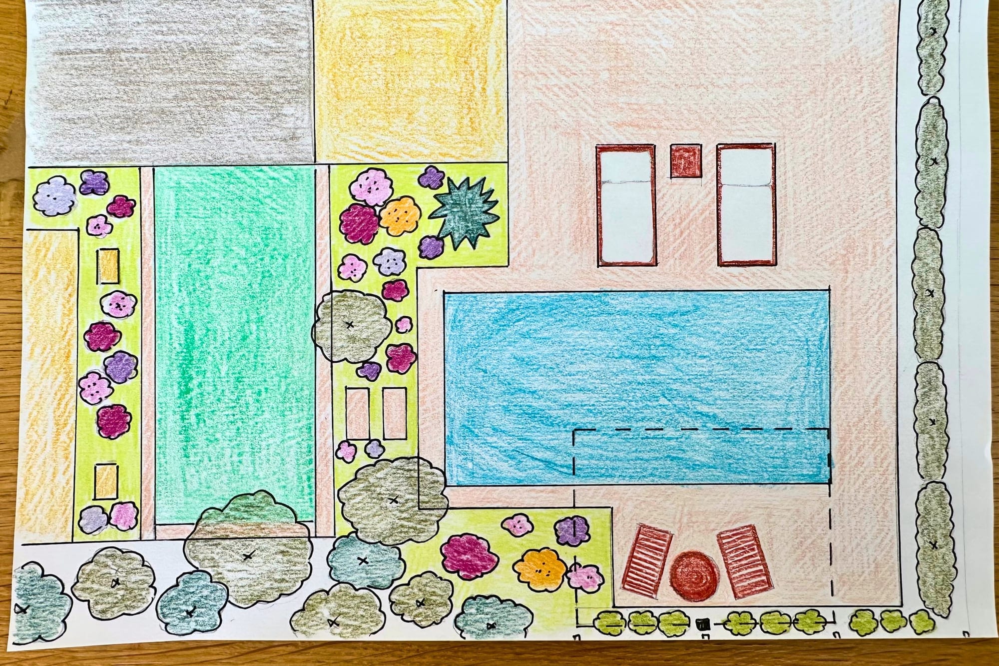A garden design hand-drawn in colored pencil with beds, a pool and hedges