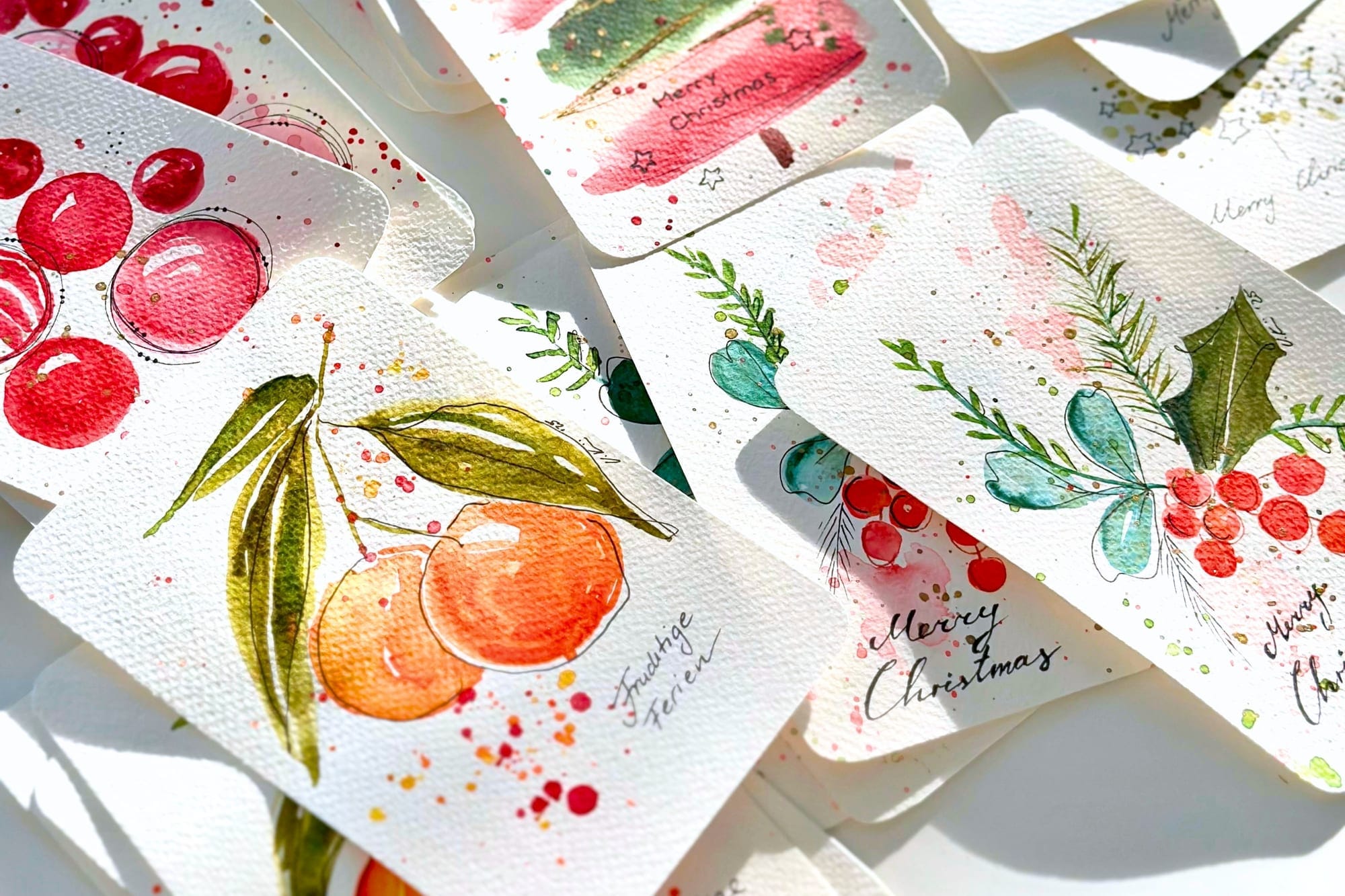 Hand-painted Christmas cards with watercolor motifs and calligraphy
